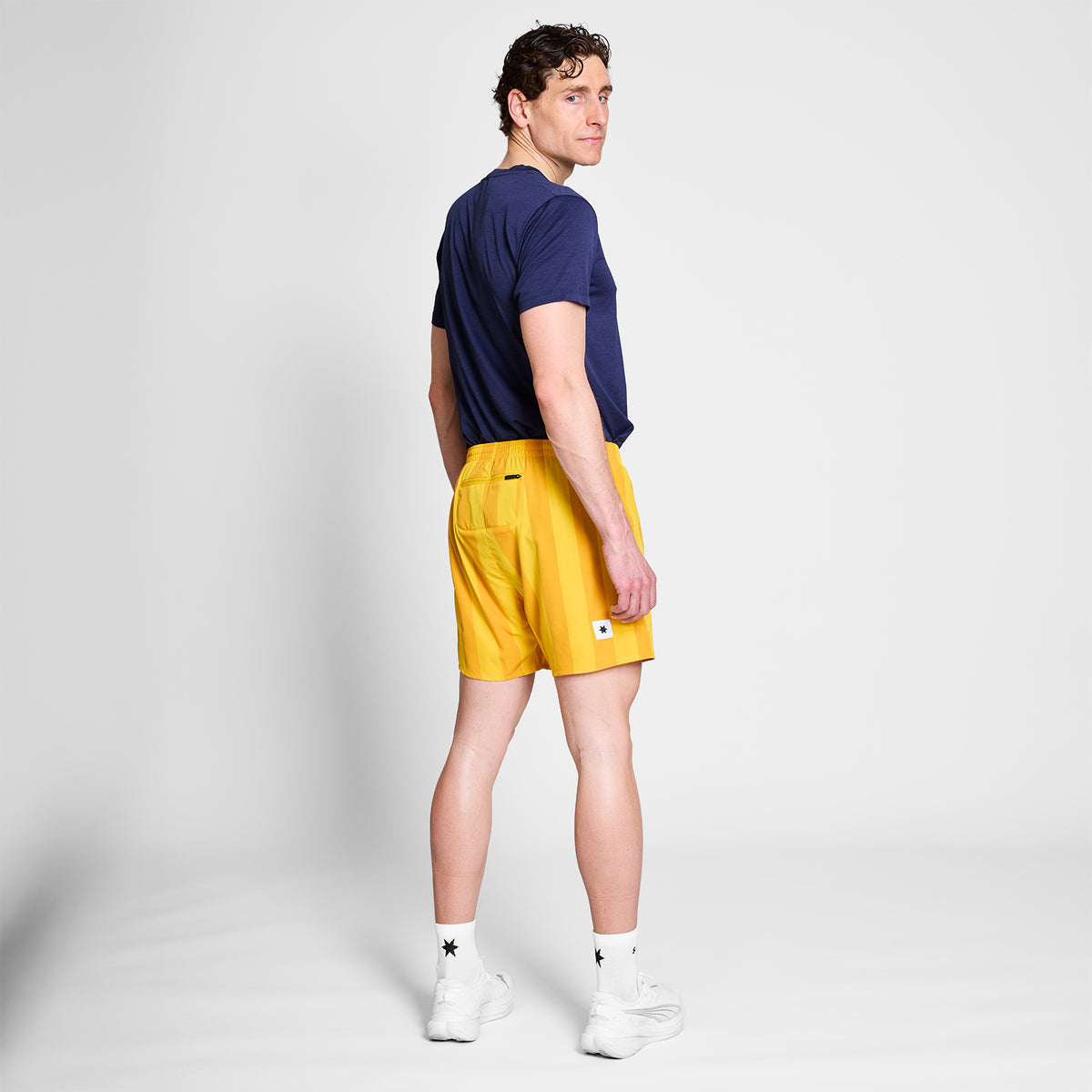 ランニングショーツ NMRSH21c008 Stripe Pace Shorts 5inch - Yellow Stripe Aop [メンズ]